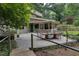 The backyard patio features a table and chairs, plus access to the home via the green side door at 1320 Shepherd St, Durham, NC 27707