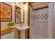 Compact bathroom with a pedestal sink, tiled shower, and charming details for a functional and stylish space at 1320 Shepherd St, Durham, NC 27707
