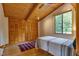 This cozy bedroom features hardwood floors and a beamed ceiling, with a window offering natural light and closet at 1320 Shepherd St, Durham, NC 27707