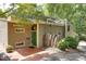 Charming exterior with a green front door, solar panels, unique art, and mature landscaping at 1320 Shepherd St, Durham, NC 27707