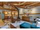 Bright, open living room with kitchen, living room and dining room. Cozy seating and exposed wood beams at 1320 Shepherd St, Durham, NC 27707