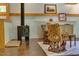 Cozy living room showcasing a wood stove, unique carved chairs, and a rustic, vintage area rug at 1320 Shepherd St, Durham, NC 27707