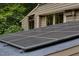 Close up of roof top solar panels installed on a residential home for energy efficiency and sustainability at 1320 Shepherd St, Durham, NC 27707