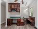 Eat-in kitchen features a breakfast nook with booth seating and a built-in desk area at 136 Dixie Ln, Youngsville, NC 27596
