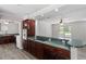 Open kitchen with green countertops, modern appliances, and adjoining dining area at 136 Dixie Ln, Youngsville, NC 27596