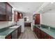Kitchen with green countertops, stainless appliances and wood cabinets at 136 Dixie Ln, Youngsville, NC 27596
