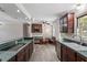 Charming kitchen with green countertops, built-in appliances, and ample cabinet space at 136 Dixie Ln, Youngsville, NC 27596