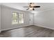 Hardwood flooring, ceiling fan, and front entrance offer a comforting view at 136 Dixie Ln, Youngsville, NC 27596