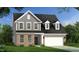 Charming two-story home showcasing a brick and gray siding exterior with a well-manicured lawn and attached garage at 141 Alden Way, Angier, NC 27501