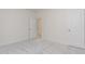 A carpeted bedroom features white trim and neutral colors, with access to an en-suite and closet at 1417 Westmoreland Dr, Raleigh, NC 27612