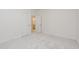 A carpeted bedroom provides access to an en-suite, ideal for a primary bedroom or guest suite at 1417 Westmoreland Dr, Raleigh, NC 27612