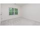 Cozy bedroom with soft carpet, natural light, and a serene atmosphere at 1417 Westmoreland Dr, Raleigh, NC 27612