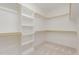 Walk-in closet with built-in shelving and hanging rods for optimal organization at 1417 Westmoreland Dr, Raleigh, NC 27612