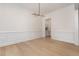 Spacious dining room featuring hardwood floors and modern lighting fixtures, ideal for entertaining guests at 1417 Westmoreland Dr, Raleigh, NC 27612