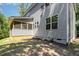 View of the home exterior features an attached screened-in porch in the backyard at 1417 Westmoreland Dr, Raleigh, NC 27612
