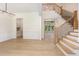 Open foyer with beautiful hardwood floors, a staircase, and ample natural light creating a welcoming space at 1417 Westmoreland Dr, Raleigh, NC 27612