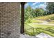 View from the porch, showcasing a lush green lawn and mature trees at 1417 Westmoreland Dr, Raleigh, NC 27612