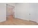 Bright, open living room with hardwood floors, and view to formal room with modern light fixture at 1417 Westmoreland Dr, Raleigh, NC 27612