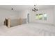Spacious loft area with contemporary lighting, natural light, and staircase at 1417 Westmoreland Dr, Raleigh, NC 27612