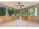 This home features a framed-in screened porch with wooden floors, perfect for enjoying the outdoors bug-free at 1417 Westmoreland Dr, Raleigh, NC 27612