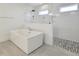 Modern bathroom features a soaking tub, frameless glass shower, and contemporary finishes at 1425 Sierra Glen Cir, Apex, NC 27502