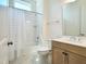 Bright bathroom featuring a shower and tub combo with stylish vanity and fixtures at 1425 Sierra Glen Cir, Apex, NC 27502