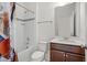 Bathroom features vanity with wood cabinets, granite countertop, and shower over tub with curtain at 1425 Sierra Glen Cir, Apex, NC 27502