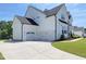 Stunning home featuring a three-car garage and lush landscaping at 1425 Sierra Glen Cir, Apex, NC 27502