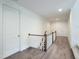 Upstairs hallway featuring hardwood floors, white walls, and neutral carpeting on the stairs at 1425 Sierra Glen Cir, Apex, NC 27502