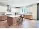 Beautiful kitchen with stainless steel appliances, hardwood floors, and large kitchen island at 1425 Sierra Glen Cir, Apex, NC 27502