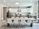 Bright and spacious kitchen with modern cabinetry, stainless steel appliances, and a large dining table at 1425 Sierra Glen Cir, Apex, NC 27502