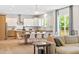 Open living space with eat-in kitchen, dining area, hardwood floors, and natural light at 1425 Sierra Glen Cir, Apex, NC 27502