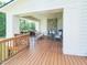 Covered porch has gorgeous wood flooring and a stone fireplace, perfect for relaxing outside at 1425 Sierra Glen Cir, Apex, NC 27502