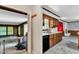 Cozy kitchen featuring wood cabinets and views to the living room and dining area, ready for your personal touches at 1500 Lakeside Dr, Garner, NC 27529