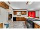 Traditional kitchen with wood cabinets, grey flooring, and white countertops at 1500 Lakeside Dr, Garner, NC 27529