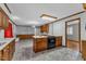 Functional kitchen with wood cabinets and modern appliances seamlessly connected to the dining and living areas at 1500 Lakeside Dr, Garner, NC 27529