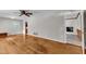 Open living room with hardwood floors and views into the kitchen at 1500 Lakeside Dr, Garner, NC 27529