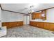 Open living room with wainscotting and hardwood-style flooring at 1500 Lakeside Dr, Garner, NC 27529