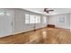 Bright living room with multiple windows and hardwood flooring at 1500 Lakeside Dr, Garner, NC 27529