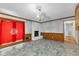 Inviting living room with fireplace, wood-look wainscotting, and chandelier at 1500 Lakeside Dr, Garner, NC 27529