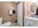 Neat bathroom featuring a vanity, toilet, and tile flooring at 1542 W Davis St, Burlington, NC 27215