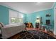 Bright bedroom with hardwood floors and large window, perfect for a home office or music room at 1542 W Davis St, Burlington, NC 27215