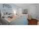 Tranquil bedroom with a white iron bed, pastel bedding, and plenty of natural light at 1542 W Davis St, Burlington, NC 27215
