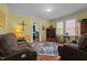 Relaxing living room featuring hardwood floors, comfortable seating, and a decorative rug at 1542 W Davis St, Burlington, NC 27215