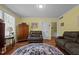 Comfortable living room with hardwood floors, neutral-toned furniture, and ample natural light at 1542 W Davis St, Burlington, NC 27215