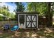 Well-maintained shed with a decorative window box and a charming black and white design at 1542 W Davis St, Burlington, NC 27215