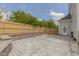 Large backyard featuring a concrete patio with retaining wall and a wooden fence for privacy at 168 Melody Ln, Cameron, NC 28326