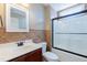 Bathroom with tiled shower and modern vanity at 168 Melody Ln, Cameron, NC 28326
