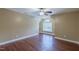Bright bedroom features hardwood floors, a ceiling fan, and an arched window that provides lots of light at 168 Melody Ln, Cameron, NC 28326