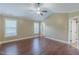 Large bedroom featuring hardwood floors, a ceiling fan, and big windows that provide lots of light at 168 Melody Ln, Cameron, NC 28326